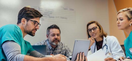 Nurses looking at a tablet