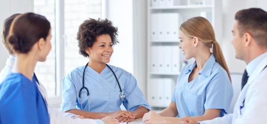 Four nurses at a meeting